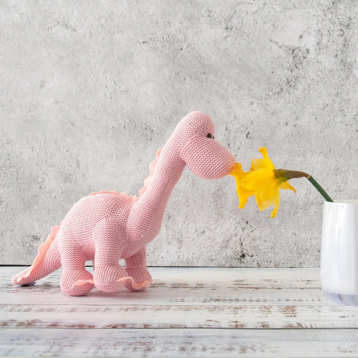 Pink Dinosaur Baby Rattle in a Knitted Organic Cotton Design